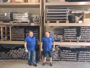 Two dudes chillin in a warehouse